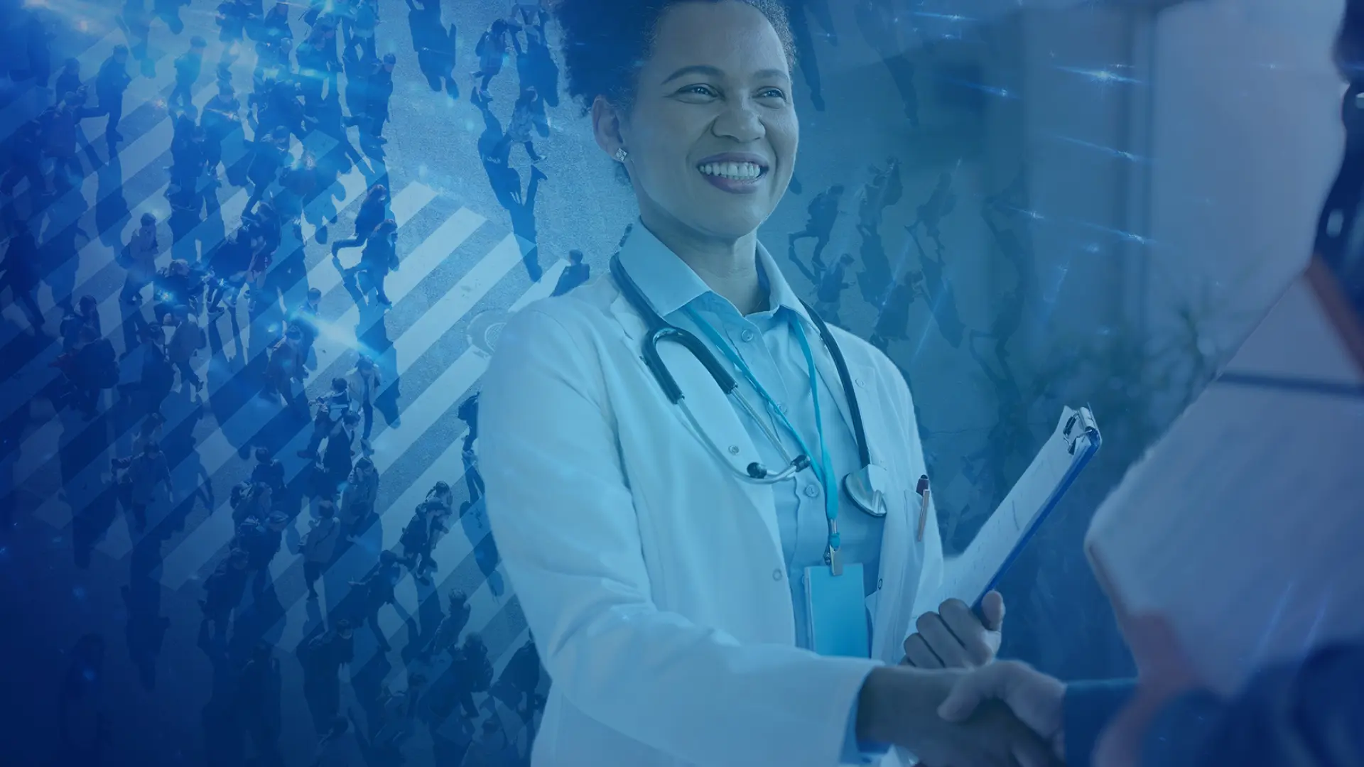Smiling provider reviewing patient chart data while shaking hands with a colleague, supported by Virtix Health population health insights for Medicare Advantage risk adjustment